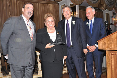 Donna E. Shalala accepts award