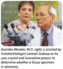 Morales and Duboue looking at specimen.